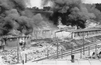 Due to catastrophic hygienic conditions and the imminent danger of spreading diseases, the barracks of camp Gusen II were burnt down by the US miltary administration on May 17th 1945. (photo credits: Courtesy of Maj. Charles R. Sandler, US 11th Armored Division, 21st Armored Infantry Battallion)