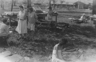 Open-air medical care for female patients near the camp hospital, May 1945. (photo credits: private property of Mrs. Mary Traub, 2nd Lieutenant of the 131st Evacuation Hospital; Courtesy of Mary Traub)