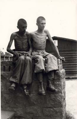 Two liberated prisoners outside Barrack 1 at Camp Gusen I. (Photograph of the Czechoslowakian news agency ČTK; Courtesy of ČTK)
